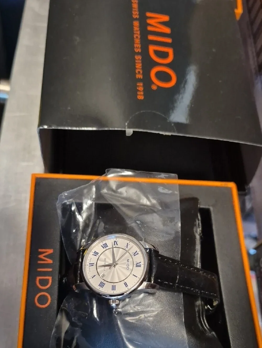 Mido Silver Dial Watch with Blue Roman Numerals and Black Strap